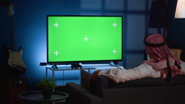 Arab Man Lounged Cozy Sofa Watching News Broadcast Green Screen — Stock Video