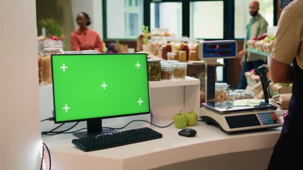 Vendor Checkout Uses Greenscreen Computer Showing Isolated Chromakey Display Desktop — Stock Video