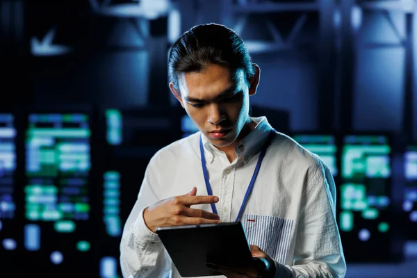 Tech support worker between server hub clusters providing processing resources for businesses worldwide. Overseeing supervisor fixes data center mainframes used for managing massive databases