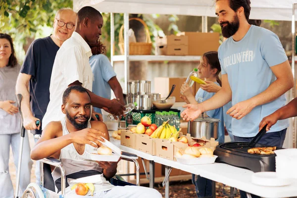 Needy African American Male Wheelchair User Receives Free Food Fruits — Stock Photo, Image