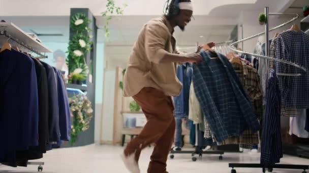 African American Man Headphones Having Fun Thrift Shop Filming Commercial — Stock Video
