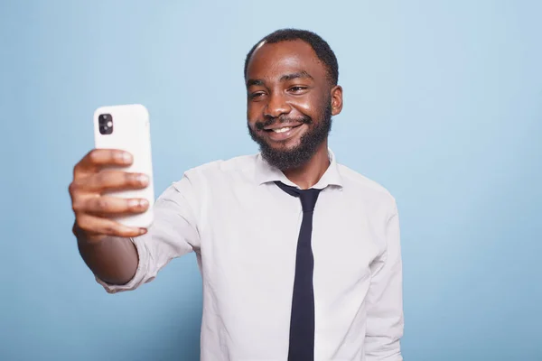 Businessman Snapping Selfie His Smartphone Front Camera Isolated Blue Background — Stock Photo, Image