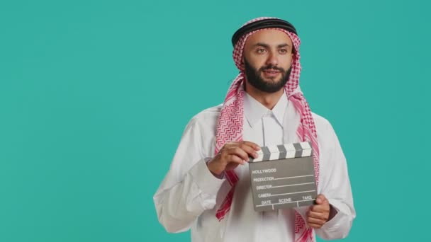 Middle Eastern Man Holds Clapperboard Used Action Takes Movie Production — Stock Video