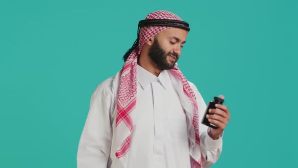 Middle Eastern Man Looks Jar Medicine Studio Preparing Take Painkillers — Stock Video