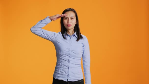 Proud Adult Presenting Military Salute Symbol Studio Raising Arm Temples — Stock Video