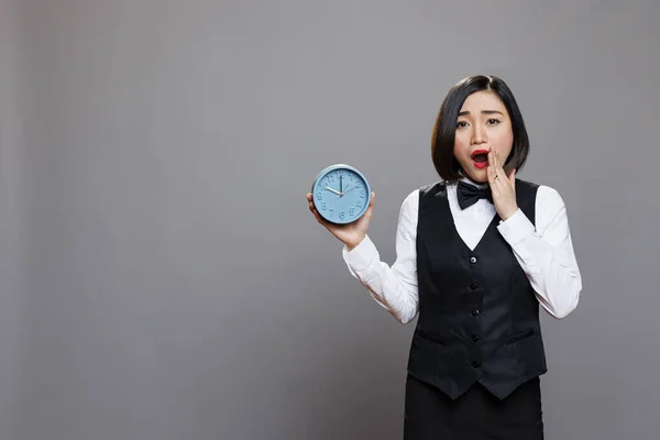 Hotel Asian Woman Receptionist Yawning While Holding Alarm Clock Looking — Stock Photo, Image