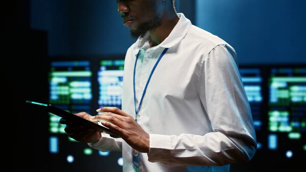 Precise engineer checking blade servers performing data backups and providing centralized storage. Technician maintenancing electric generators ensuring operational continuity, close up