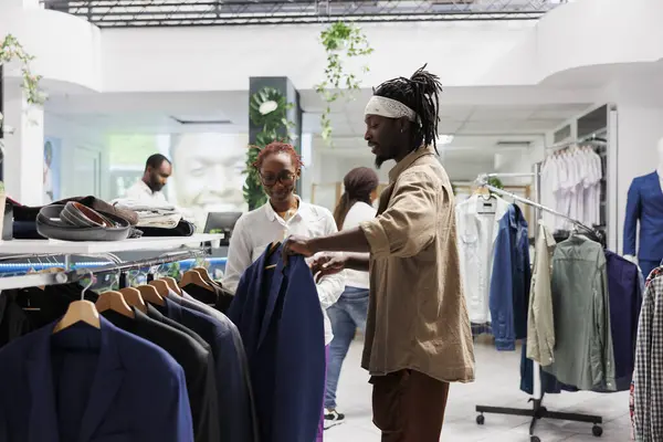 African American Buyer Seller Discussing Fashion Trends While Choosing Jacket — Stock Photo, Image