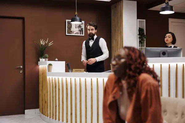 Hotel Receptionist Working Front Desk Helping Tourists Accommodation Great Hospitality — Stock Photo, Image
