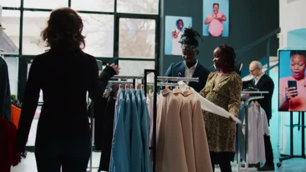 Employees Team Assisting Pregnant Woman Find Trendy Clothes Showing Multiple — Stock Video
