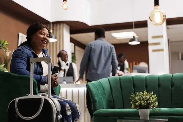 Happy Young African American Woman Sitting Hotel Lobby Suitcase Holding — Stock Photo, Image