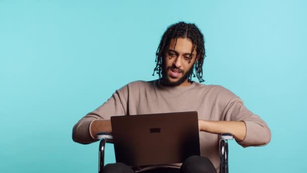 Man Wheelchair Chatting Friend Internet Videocall Using Laptop Application Bipoc — Stock Video
