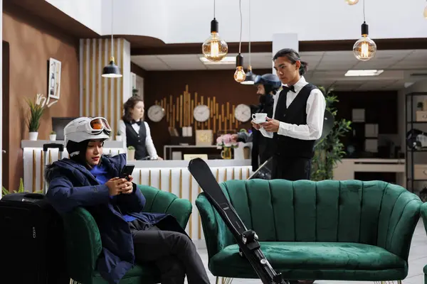 Hotel Reception Asian Female Tourist Winter Attire Uses Digital Device — Stock Photo, Image