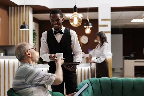 African American Employee Serving Coffee Eldery Male Tourist Tablet Luxury — Stock Photo, Image
