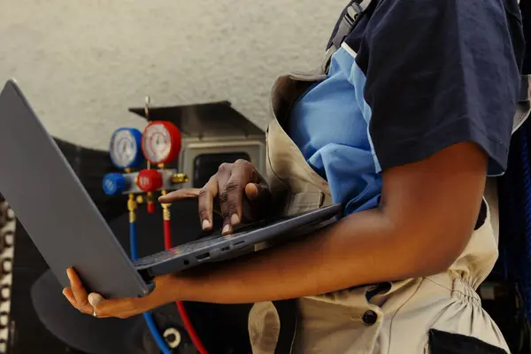 Specialist African American Mechanic Using Laptop Look Online New Capacitor — Stock Photo, Image