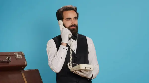 Luxurious Bellhop Answers Landline Phone Call Studio Talking Travellers Room — Stock Photo, Image