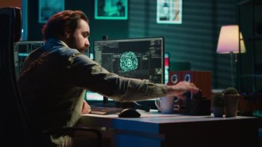 Geliştirici, PC 'ye içinde bilinçli yapay zeka el sallayan, selamlayan yaratıcı içeren bir disk yerleştiriyor. Bilgisayara yerleştirilen kartuşlar, uyanan benlik yapay zeka, kamera A