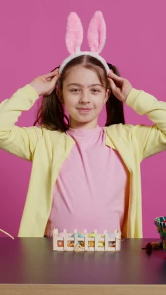 Joyful Child Putting Bunny Ears Her Head Waving Camera Saying — Stock Video