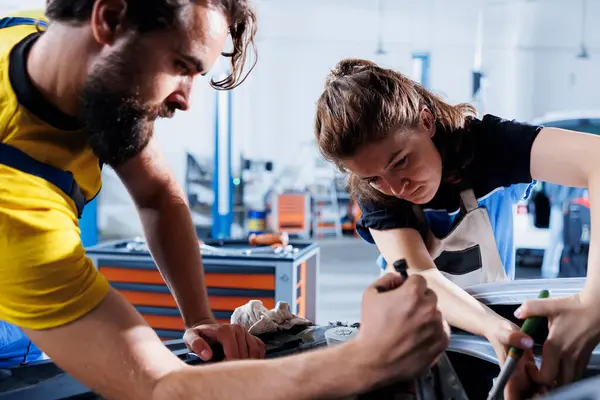 Experienced Repairmen Auto Repair Shop Working Together Fixing Car Discussing — Stock Photo, Image