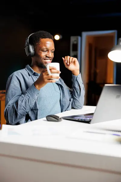 African American Guy Solving Economy Tasks Online Having Fun Listening — Stock Photo, Image
