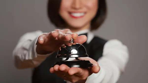 Receptionist Posing Service Bell Ringing Camera Expressing Assistance Front Desk — Stock Photo, Image