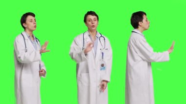 Kadın sağlık uzmanı hiçbir belirti göstermiyor. Stüdyoda olumsuzluğu ve öfkeyi dile getiren yeşil perde arkaplanına kızıyor. Kızgın doktor bağırıyor ve insanlara bağırıyor. Kamera B.