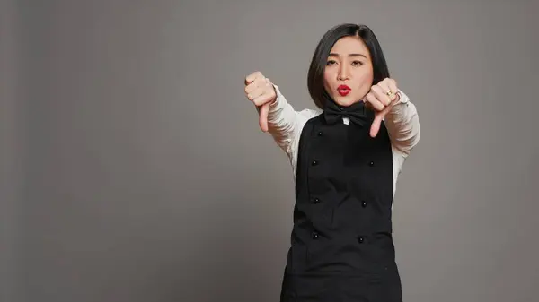 Asian Restaurant Hostess Showing Thumbs Dislike Sign Expressing Negativity Disapproval — Stock Photo, Image