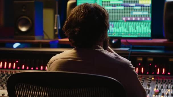Skilled Sound Designer Enjoying His Own Music Creating Mixing Console — Stock Video