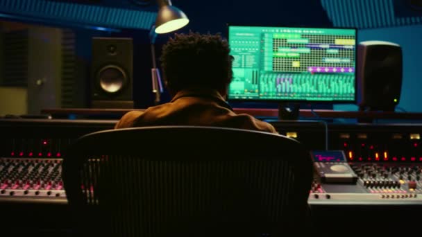 African American Audio Engineer Using Sound Mixing Console Managing Tracks — Stock Video