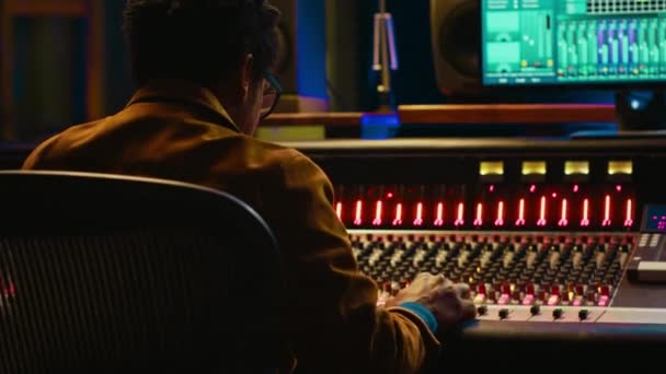 African American Audio Engineer Using Sound Mixing Console Managing Tracks — Stock Video