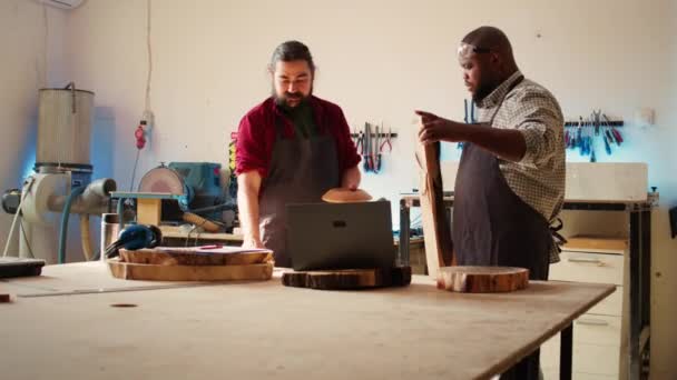 Woodworker Looking Blueprints Laptop Brainstorming Colleague Next Steps Wood Processing — Stock Video