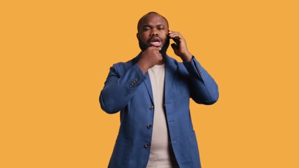 African American Man Having Thoughtful Conversation Friend Telephone Call Studio — Stock Video