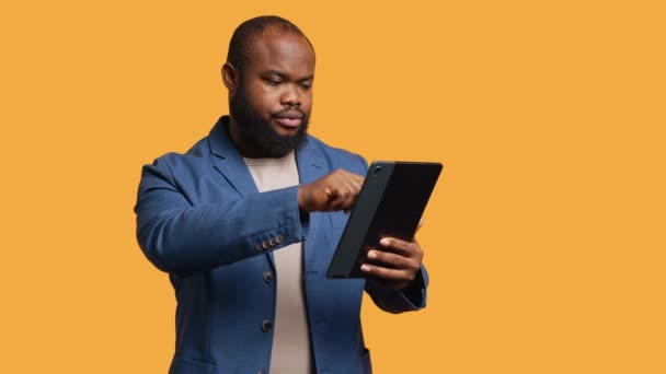 Man Happily Scrolling Tablet Touchscreen Check Social Media Feed African — Αρχείο Βίντεο