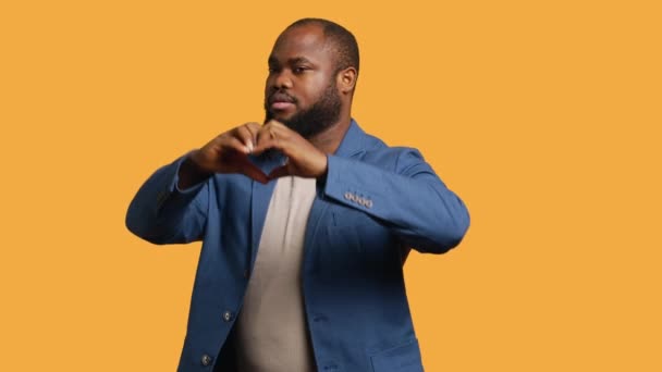 Portrait Jolly Friendly African American Man Doing Heart Symbol Shape — Stock video