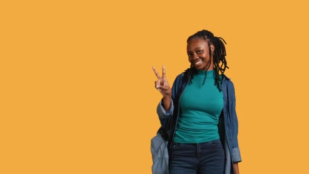 Jolly African American Young Woman Smiling Doing Victory Hand Sign — Stock Video