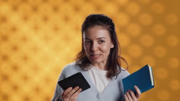 Woman Choosing Physical Electronic Books Favoring Ebooks Throwing Other Away — Vídeos de Stock