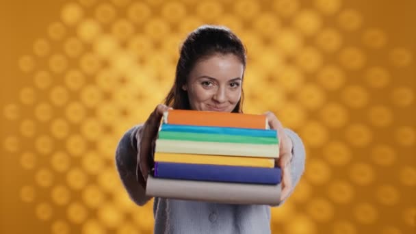 Portrait Friendly Woman Offering Stack Textbooks Useful School Exam Isolated — Video