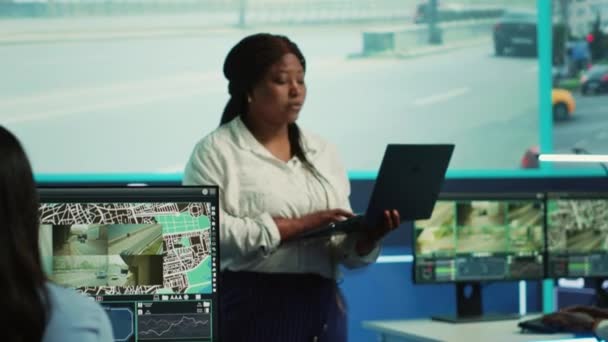 African American Manager Guiding Her Team Monitor Surveillance Footage Big — 비디오