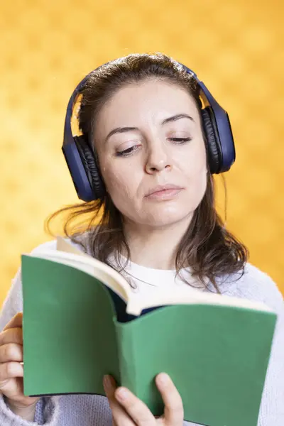 Woman Concentrating Reading Book Relaxing Listening Audio White Noise Isolated — стоковое фото