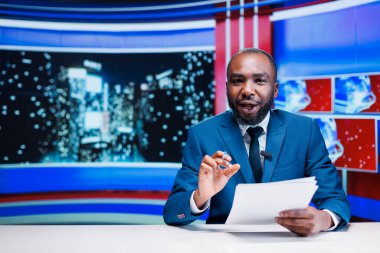 Talk show host addressing news on live transmission for global television program, using daily headlines to present important information and incidents. Presenter in studio doing reportage. clipart