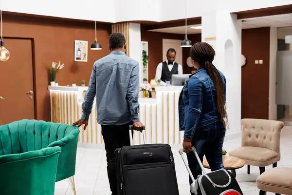 Rear View Young African American Family Couple Arriving Resort Hotel — Foto Stock