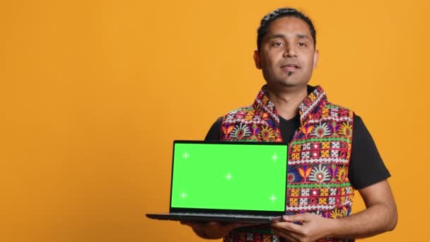 Upbeat Tech Specialist Doing Promotion Using Isolated Screen Laptop Studio — стокове відео