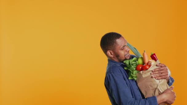 Young Man Struggling Carry Paper Bag Full Fresh Bio Fruits — Videoclip de stoc
