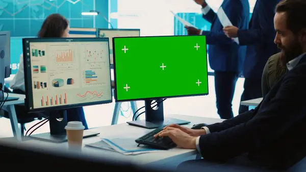 stock image Sales manager examining success and efficiency metrics within the firm, reviews progress details next to isolated display on pc. Administrator evaluating statistics and team productivity. Camera A.