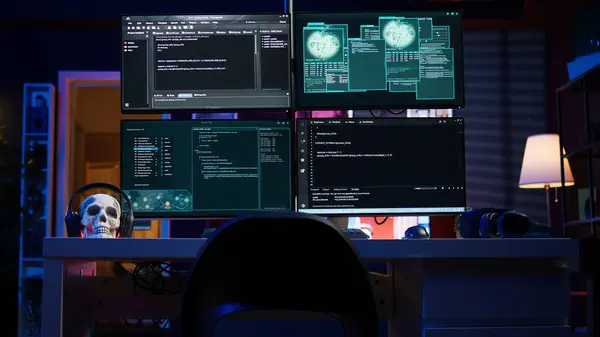 stock image Panning shot of high tech computer system running malicious code in empty apartment. PC monitors in empty neon lit criminal hideout used by hackers to commit illegal activities