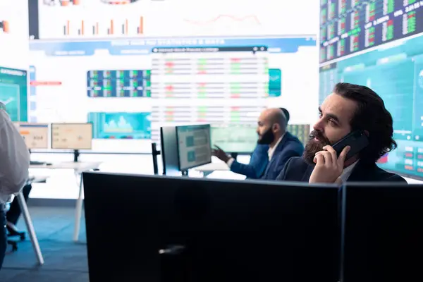 stock image Management associate sharing insight on annual statistics during a call with the advisory board, providing initiatives to enhance operational performance metrics. Big data on a screen.