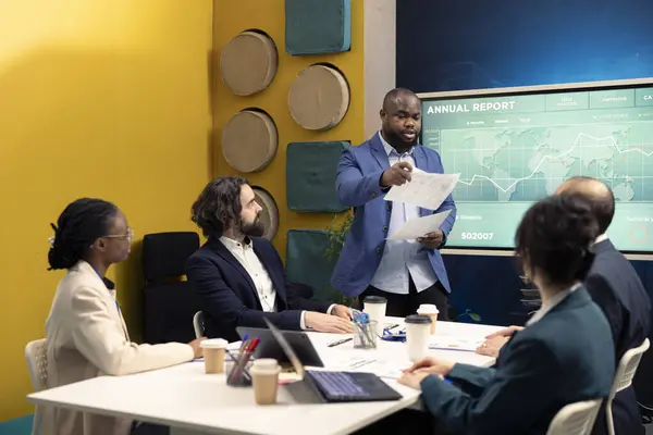 stock image Corporate employees reviewing transactional info to improve customer satisfaction, expanding on the market. General director and his team making critical decisions regarding activity development.