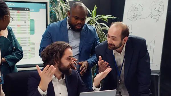 stock image Tired overworked employee deciding to quit his job during important meeting, getting sick of being held responsible by the manager. Frustrated corporate worker leaving conference room. Camera A.