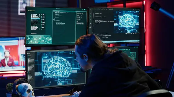 stock image Rogue computer scientist uses AI machine learning to develop zero day exploit undetectable by antivirus. Hacker uses artificial intelligence neural networks to build script tricking firewall, camera A