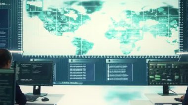 Hükümetin hackleme odasındaki uzmanlardan oluşan siber istihbarat ekibi ulusal sırları korumanın yollarını arıyor. Dijital güvenlik, siber gözetim ve siber terörizmin önlenmesi. Kamera B.
